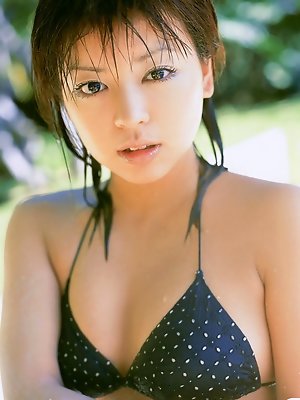 Flirtatious asian hottie allures in her many different bikinis